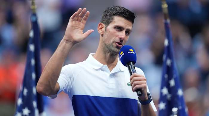 Novak Djokovic holding a mike at the 2021 U.S. Open